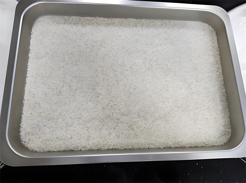 What's the cooking time for rice in a commercial steamer